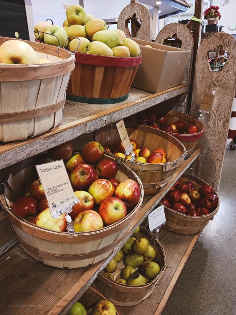 baskets of apples on a shelf at Bellewood Acres Farm Store